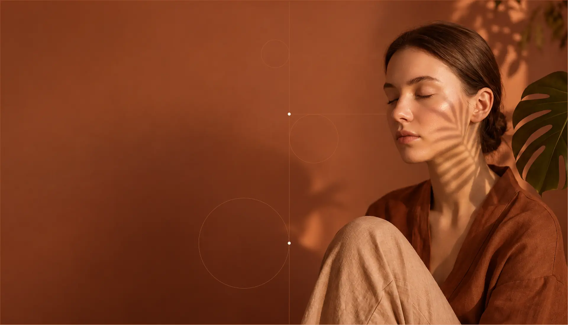 Woman resting in warm terracotta light at VITALEA